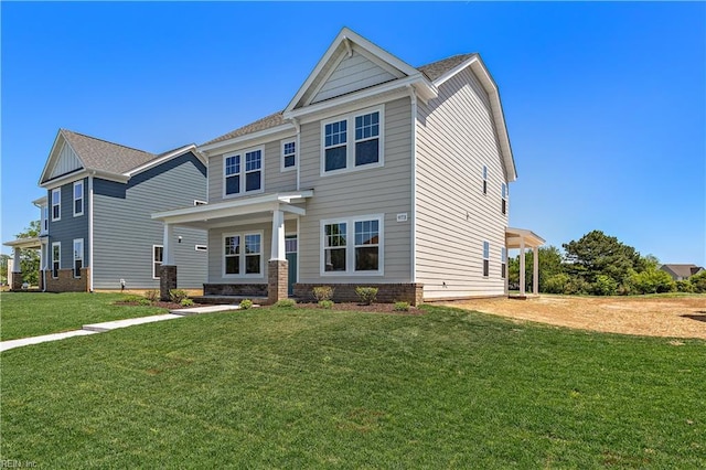 craftsman-style home with a front yard