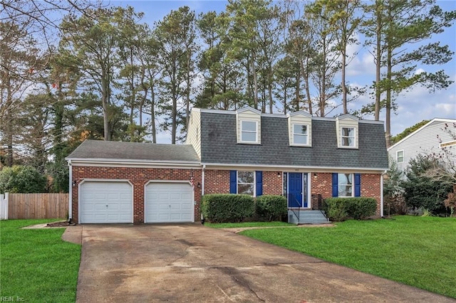 cape cod home featuring a garage and a front yard