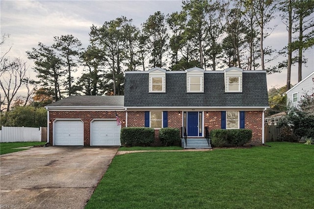 new england style home with a garage and a yard