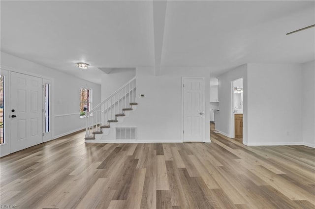 entryway with light hardwood / wood-style flooring