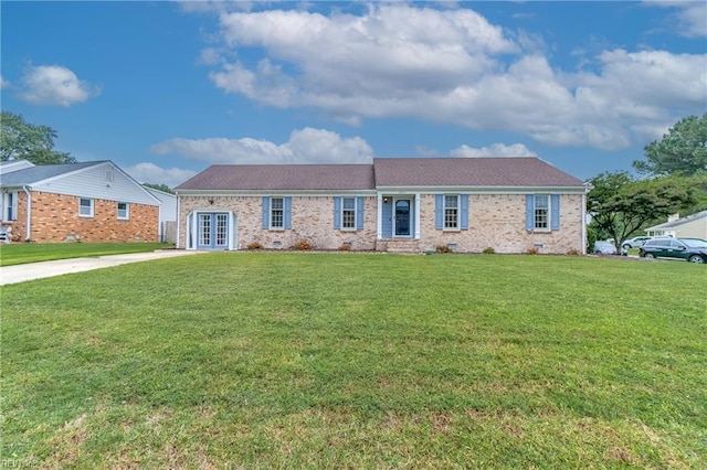 ranch-style house featuring french doors and a front lawn