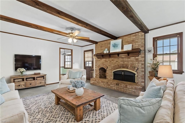 living room with ceiling fan, beam ceiling, and a brick fireplace