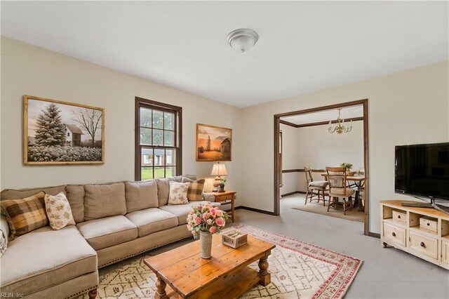 living room featuring a notable chandelier