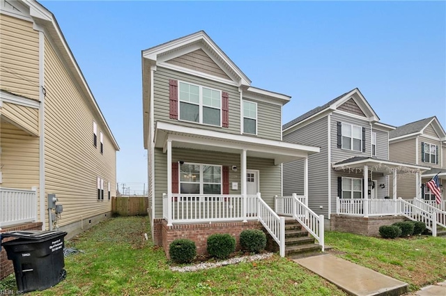 view of front of home featuring a porch and a front lawn