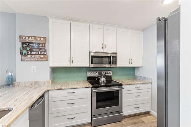 kitchen with white cabinets and stainless steel appliances