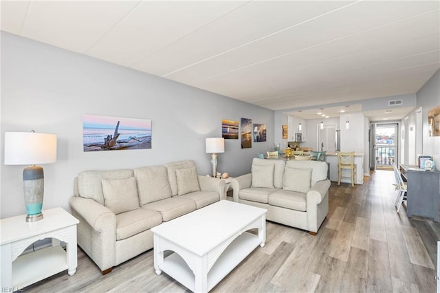 living room with light hardwood / wood-style floors