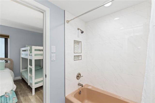 bathroom with shower / tub combo with curtain and wood-type flooring