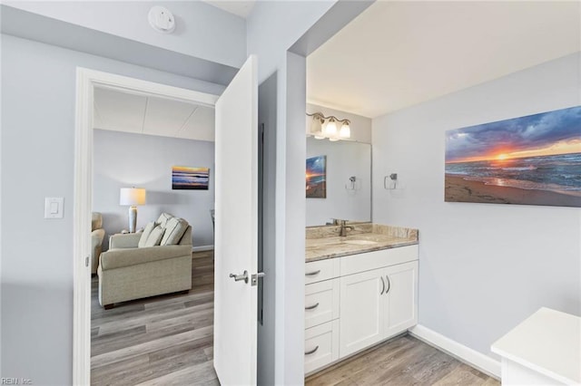 bathroom featuring hardwood / wood-style floors and vanity