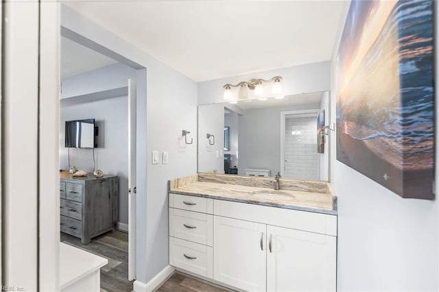 bathroom featuring wood-type flooring and vanity