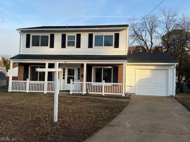 view of front facade featuring a porch and a garage