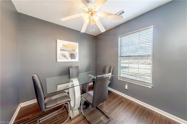 dining area with hardwood / wood-style flooring, plenty of natural light, and ceiling fan