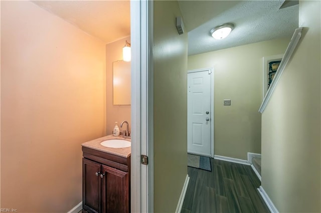 bathroom featuring hardwood / wood-style floors and vanity