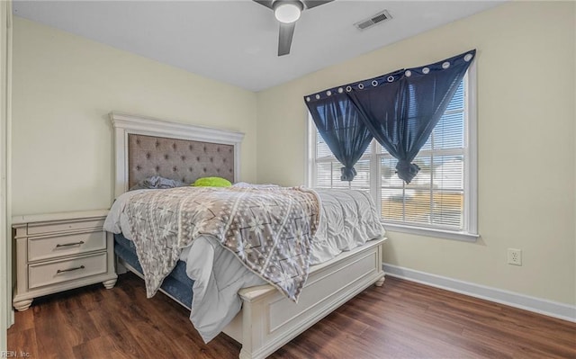 bedroom featuring dark hardwood / wood-style flooring and ceiling fan