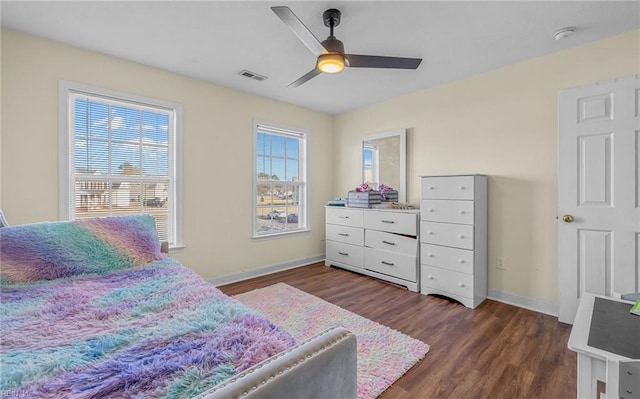 bedroom featuring ceiling fan and dark hardwood / wood-style floors