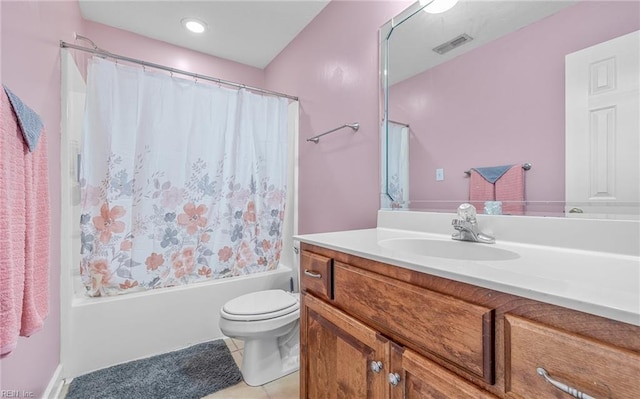 full bathroom featuring tile patterned floors, vanity, shower / tub combo, and toilet