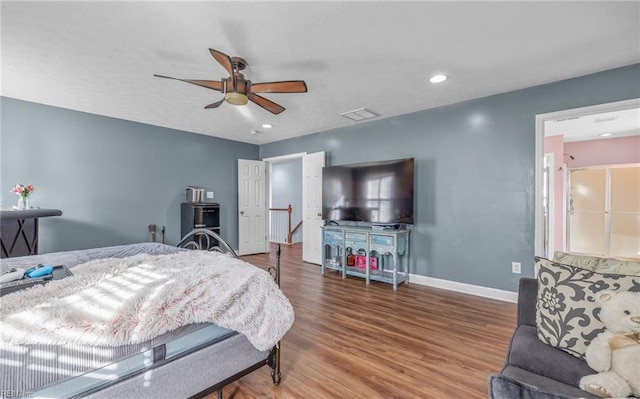 bedroom featuring wood-type flooring and ceiling fan