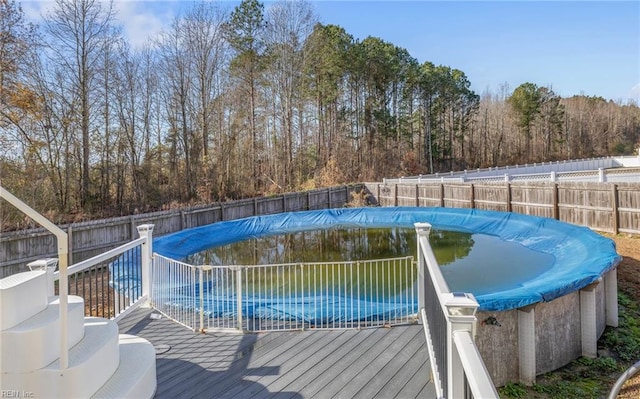 view of pool with a wooden deck