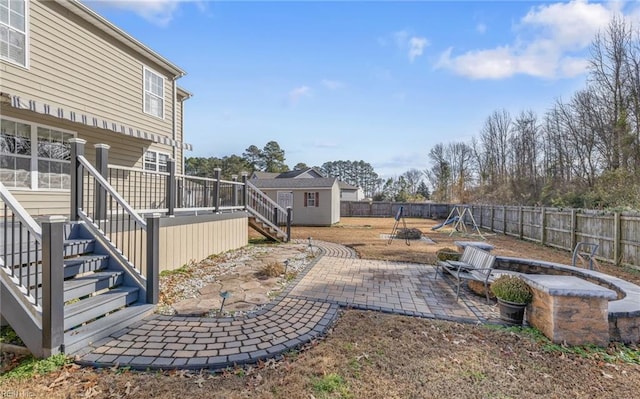 view of yard with a patio and a wooden deck