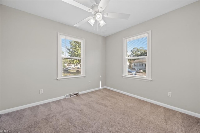 carpeted empty room with ceiling fan