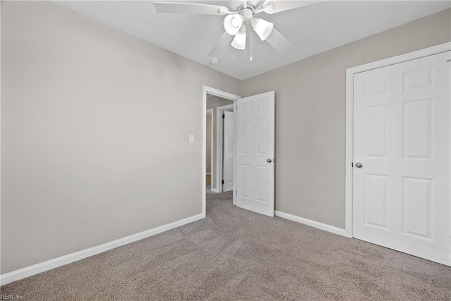 unfurnished bedroom with ceiling fan and carpet floors