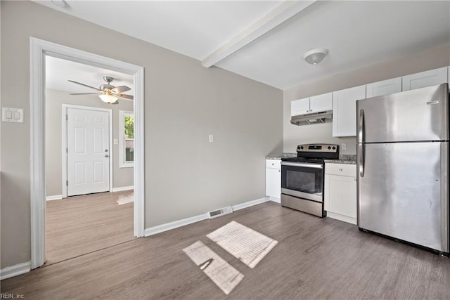 kitchen with white cabinetry, hardwood / wood-style floors, beamed ceiling, and appliances with stainless steel finishes