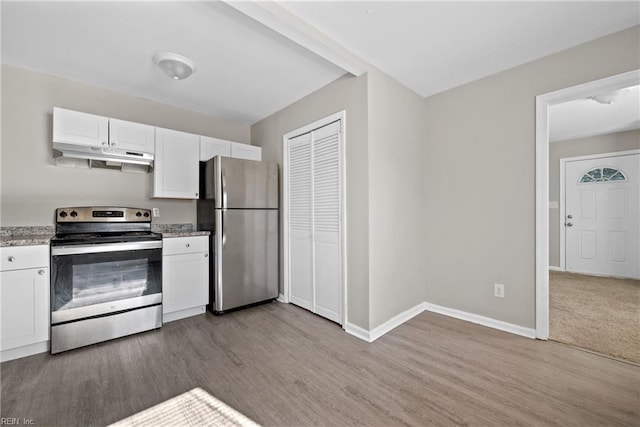 kitchen featuring white cabinets, appliances with stainless steel finishes, and light hardwood / wood-style floors