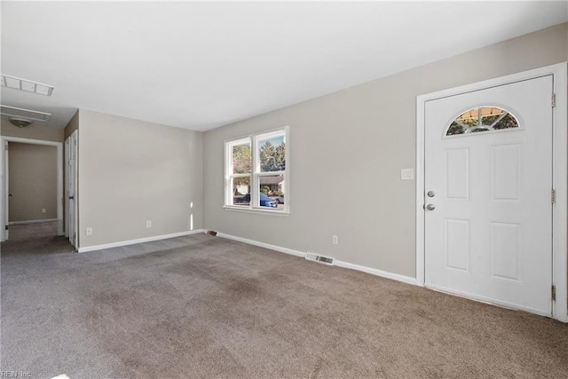 foyer with carpet flooring