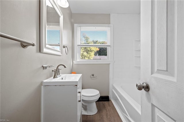 bathroom featuring hardwood / wood-style floors, vanity, and toilet