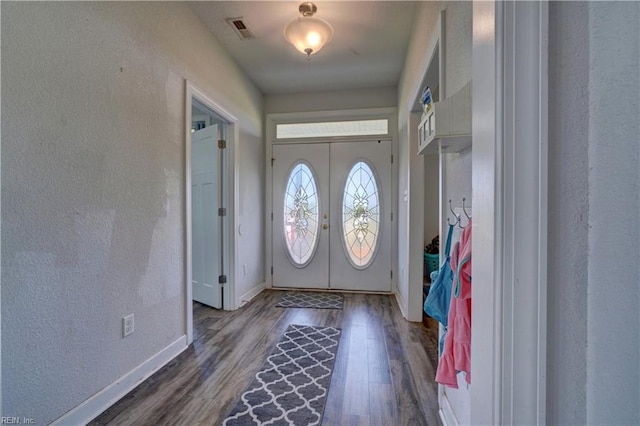 entryway with french doors and dark wood-type flooring