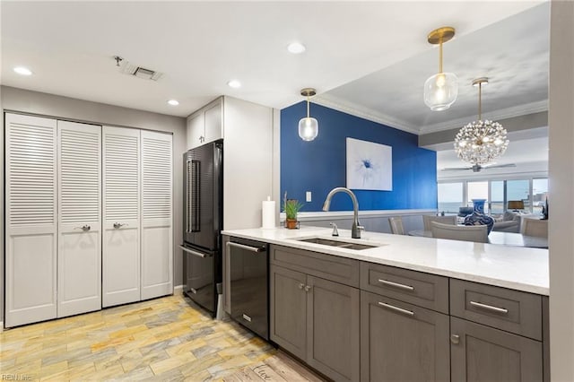 kitchen with high end refrigerator, stainless steel dishwasher, crown molding, sink, and decorative light fixtures