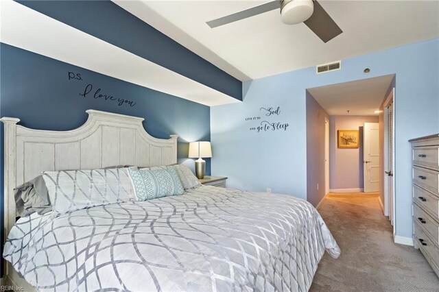 bedroom with ceiling fan and light colored carpet