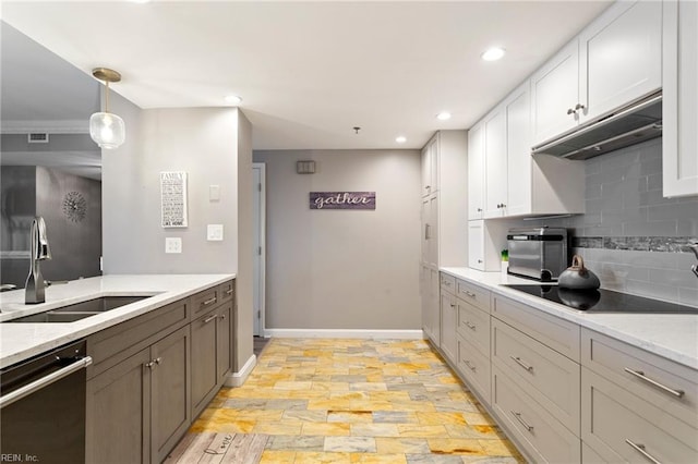 kitchen featuring light wood-type flooring, stainless steel dishwasher, black electric cooktop, sink, and white cabinets