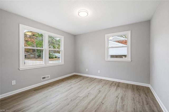 spare room with light wood-type flooring