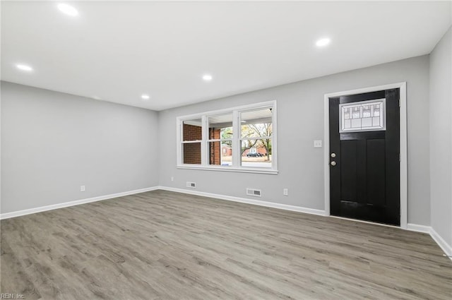 foyer with light hardwood / wood-style floors