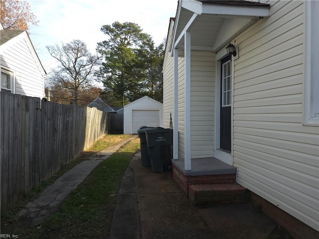 view of side of home featuring an outdoor structure