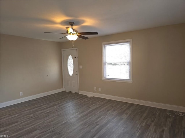 entryway featuring ceiling fan and dark wood-type flooring