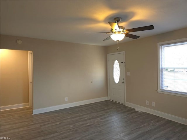 entrance foyer featuring ceiling fan and dark wood-type flooring