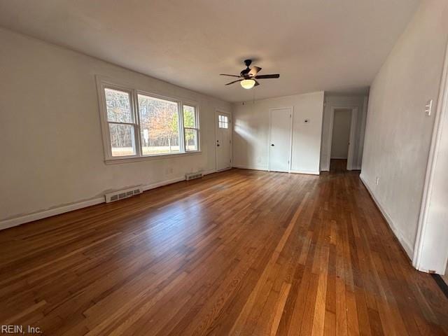 unfurnished bedroom with dark hardwood / wood-style floors and ceiling fan