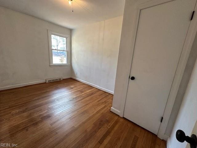 unfurnished room featuring hardwood / wood-style floors