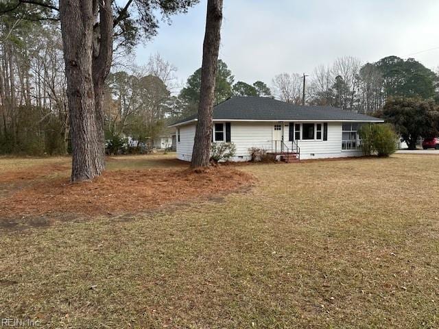 ranch-style house with a front lawn