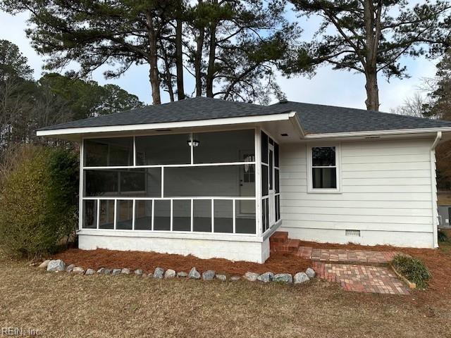 view of home's exterior featuring a sunroom