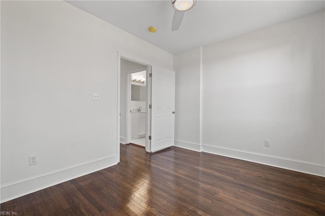 unfurnished room with dark hardwood / wood-style floors and ceiling fan