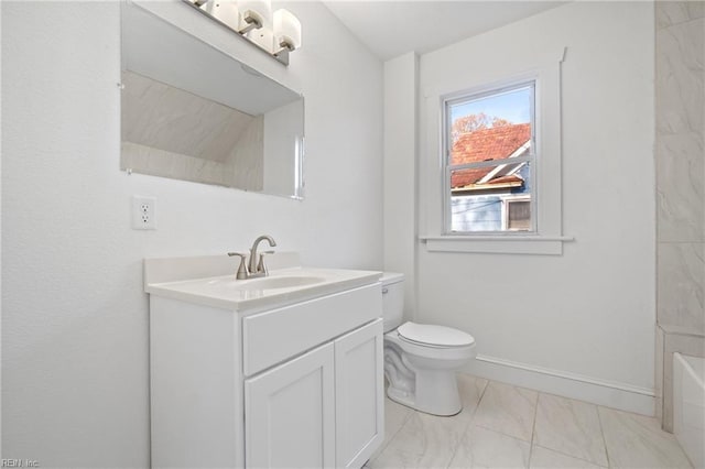 bathroom with vanity, toilet, and walk in shower