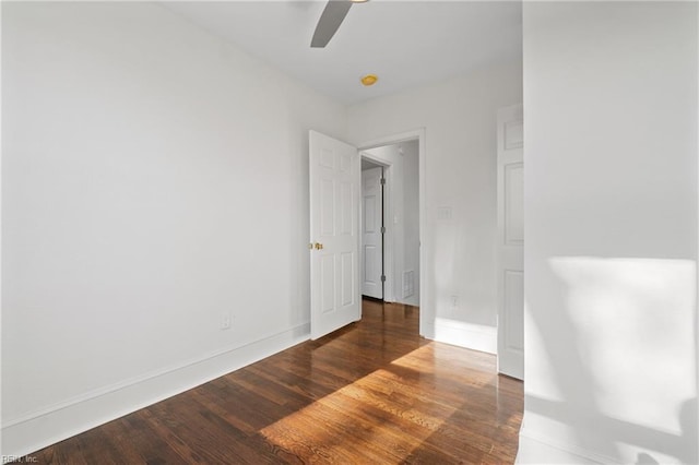 empty room with ceiling fan and wood-type flooring