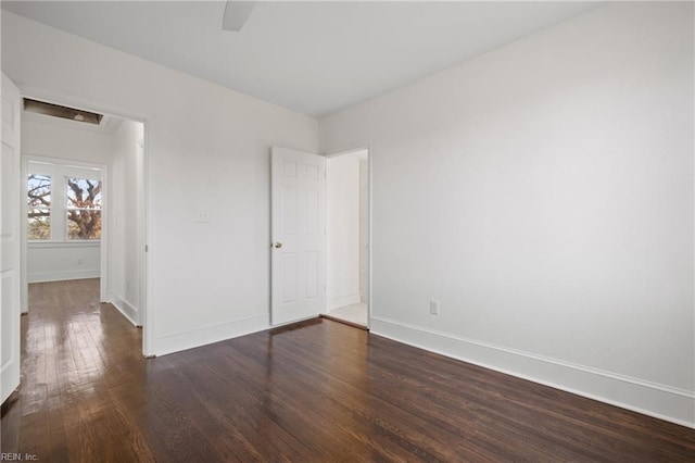 unfurnished bedroom featuring dark hardwood / wood-style floors and ceiling fan