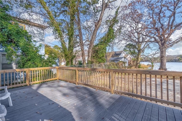 wooden deck featuring a water view