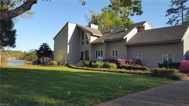 view of side of home featuring a yard