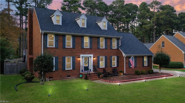 view of front of home with a yard