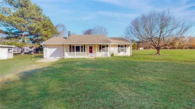 single story home featuring covered porch, a garage, and a front lawn