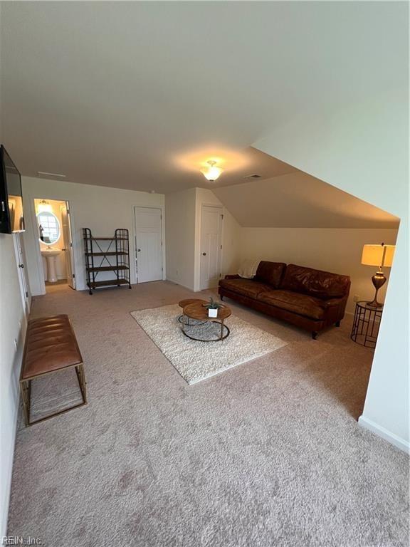 unfurnished living room featuring carpet flooring